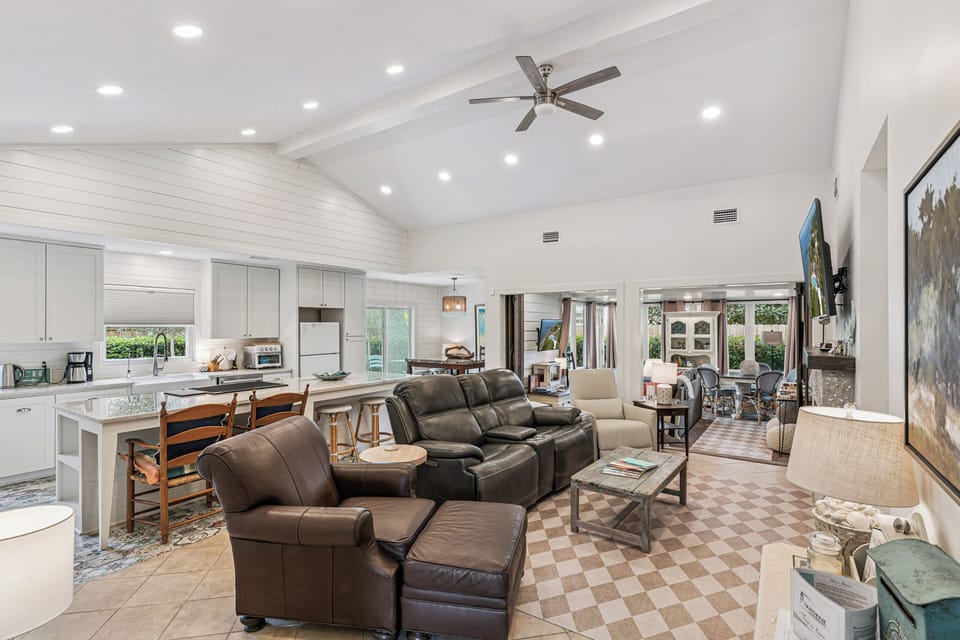 Relax in this bright open-concept space where your living room flows seamlessly into a fully-equipped kitchen, perfect for entertaining.