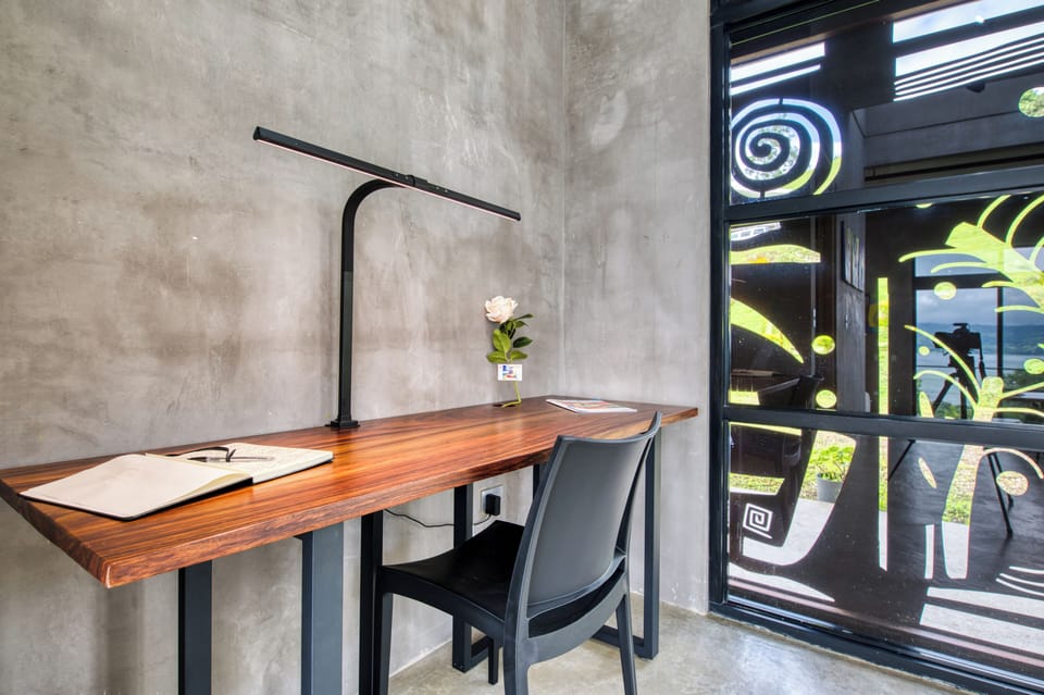 A generous workspace with lighting for those moments when you really must engage with home or work.