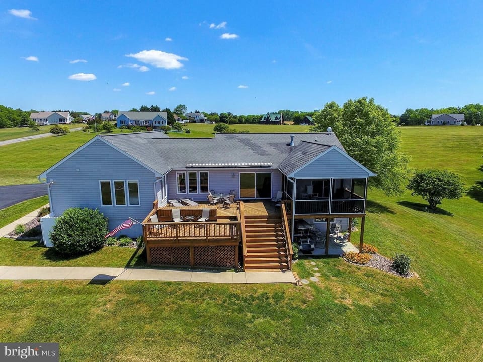 Aerial views of rear of home of deck, porches and more!