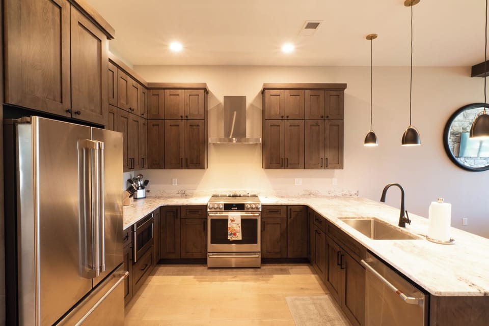 Fully Stocked Kitchen With Custom Cabinets & Stainless Steel Appliances 