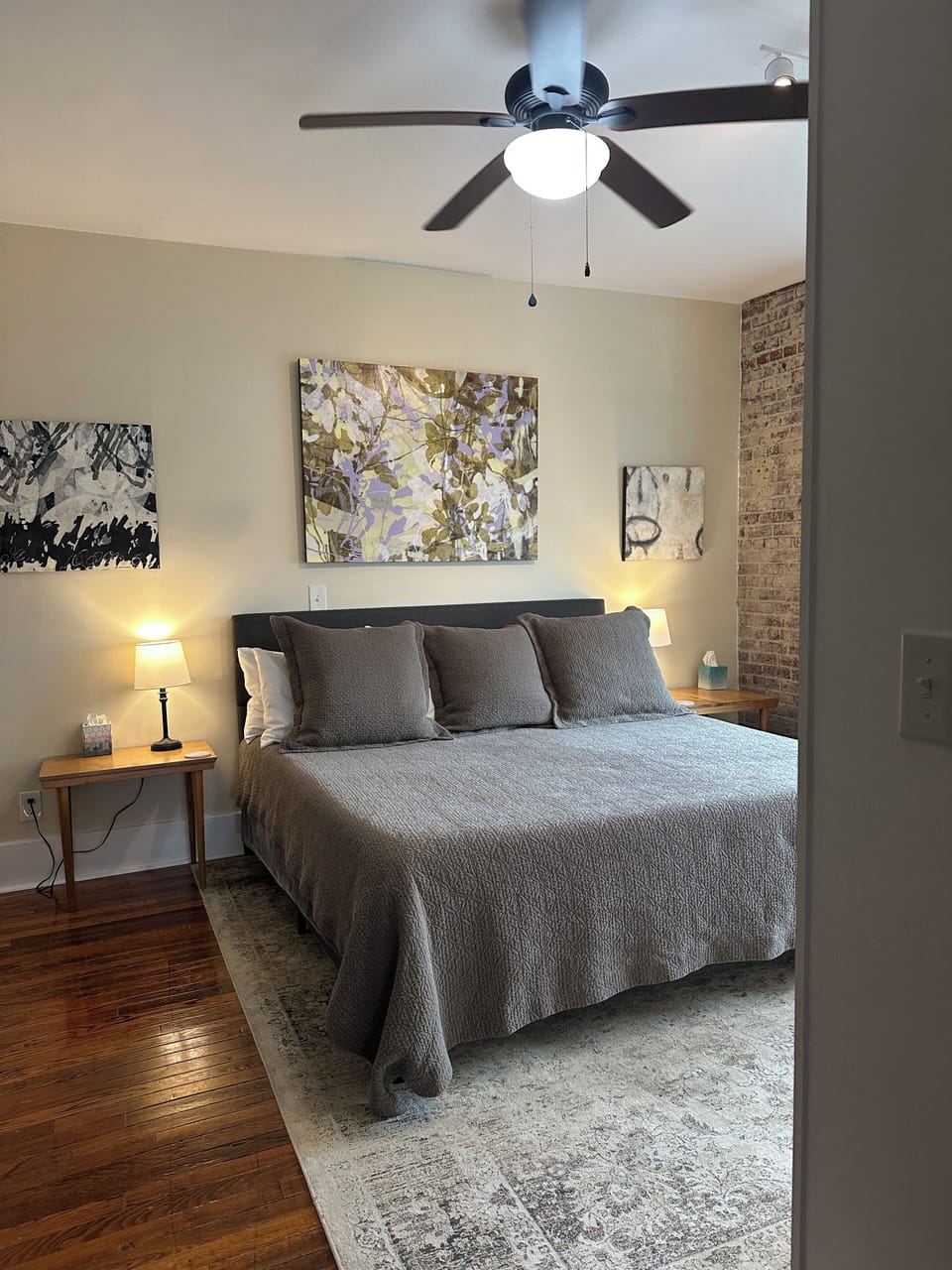 View of King-sized bed with art. The bed is so comfy folks ask how to buy it. 