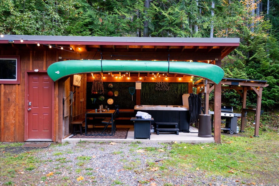 Outdoor dining for 8, hot tub, gas grill, heat lamp, and string lights