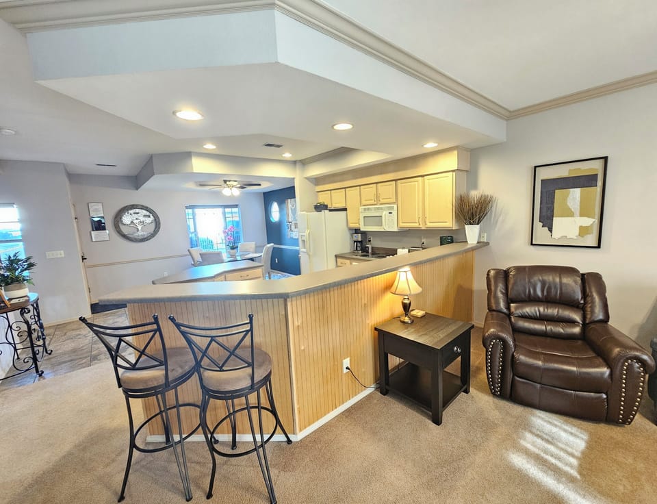 Breakfast bar, tall chairs, and a great way to enjoy the dining!