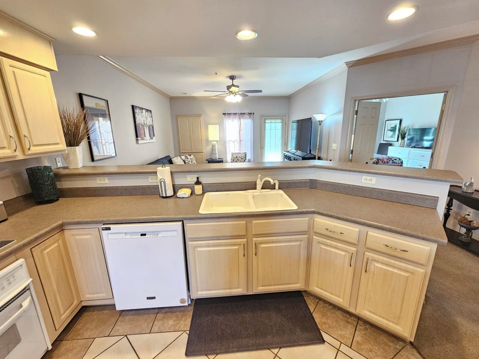 This kitchen beautifully overlooks the living room and gorgeous view!