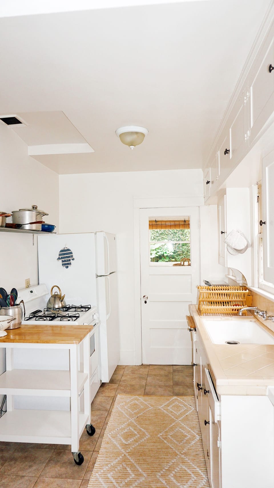 Includes fridge & freezer, sink & drying rack, microwave, oven, and toaster oven
