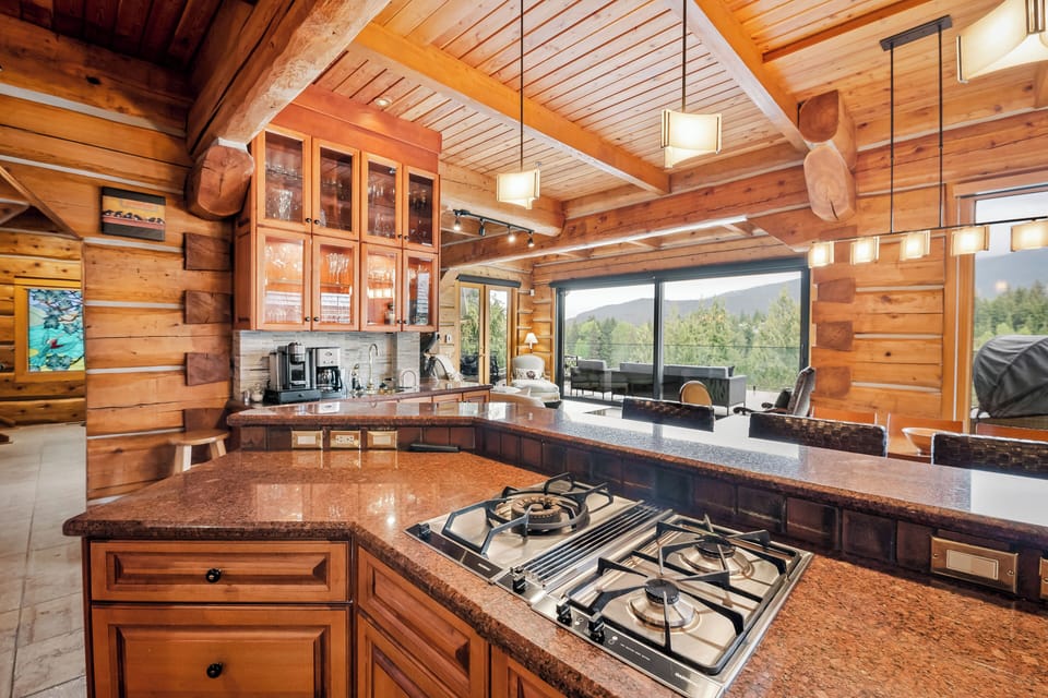 The wet bar is located just off the kitchen, lots of glassware and a fridge.