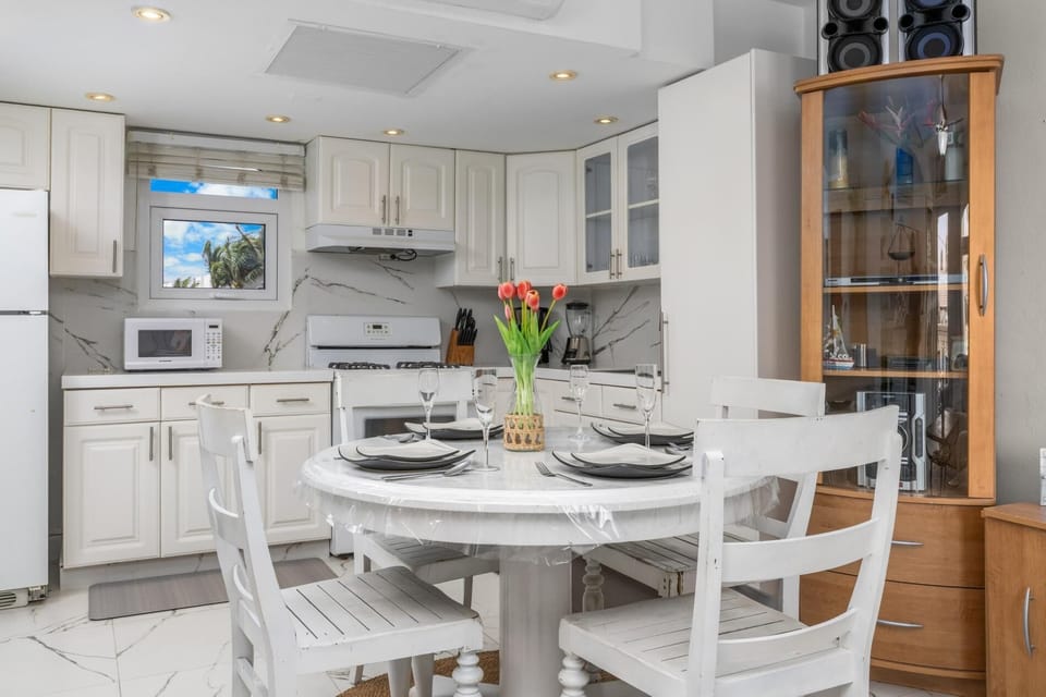 Just steps away, the dining area offers a cozy space to enjoy meals together, making it ideal for families or friends traveling as a group.