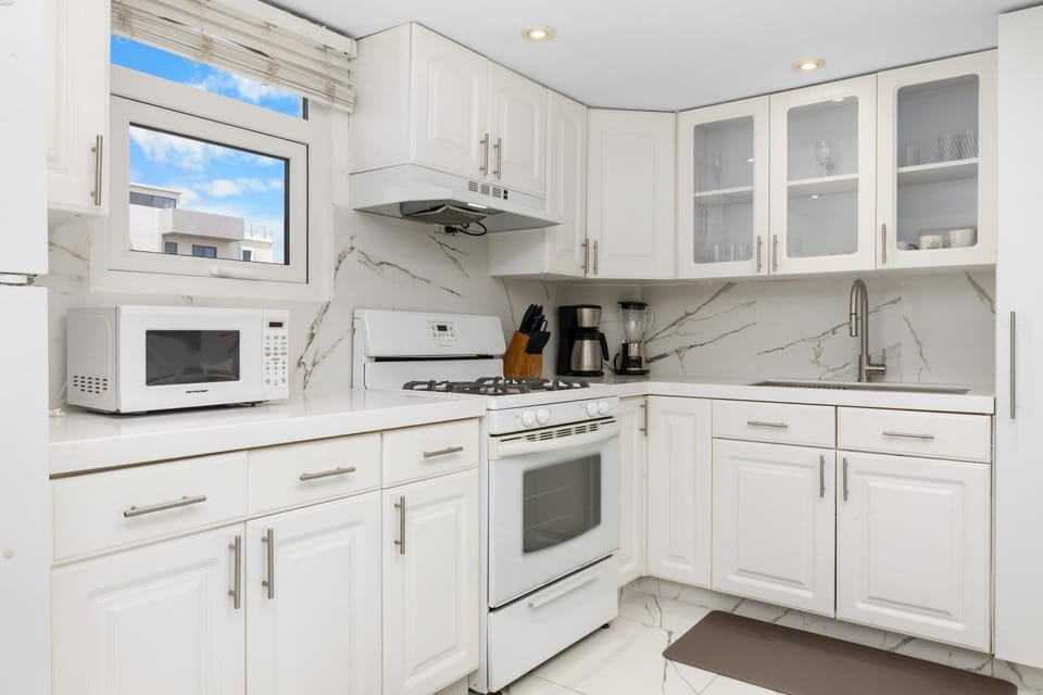 Experience the heart of the home in this open-layout kitchen and dining area, designed for comfort and connection