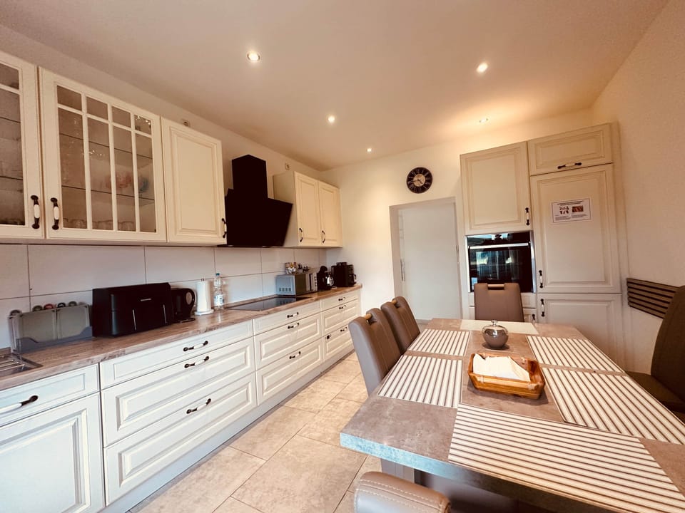 Large kitchen with dining area for shared meals