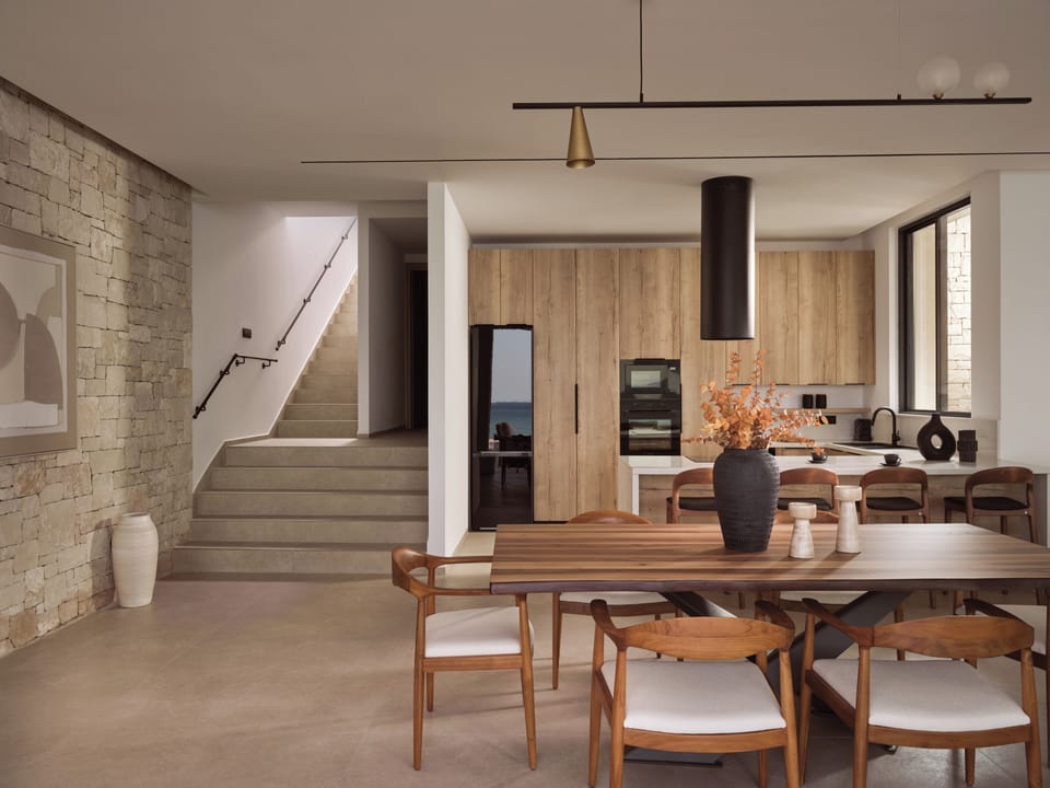 The fully equipped kitchen with indoor dining settings. 