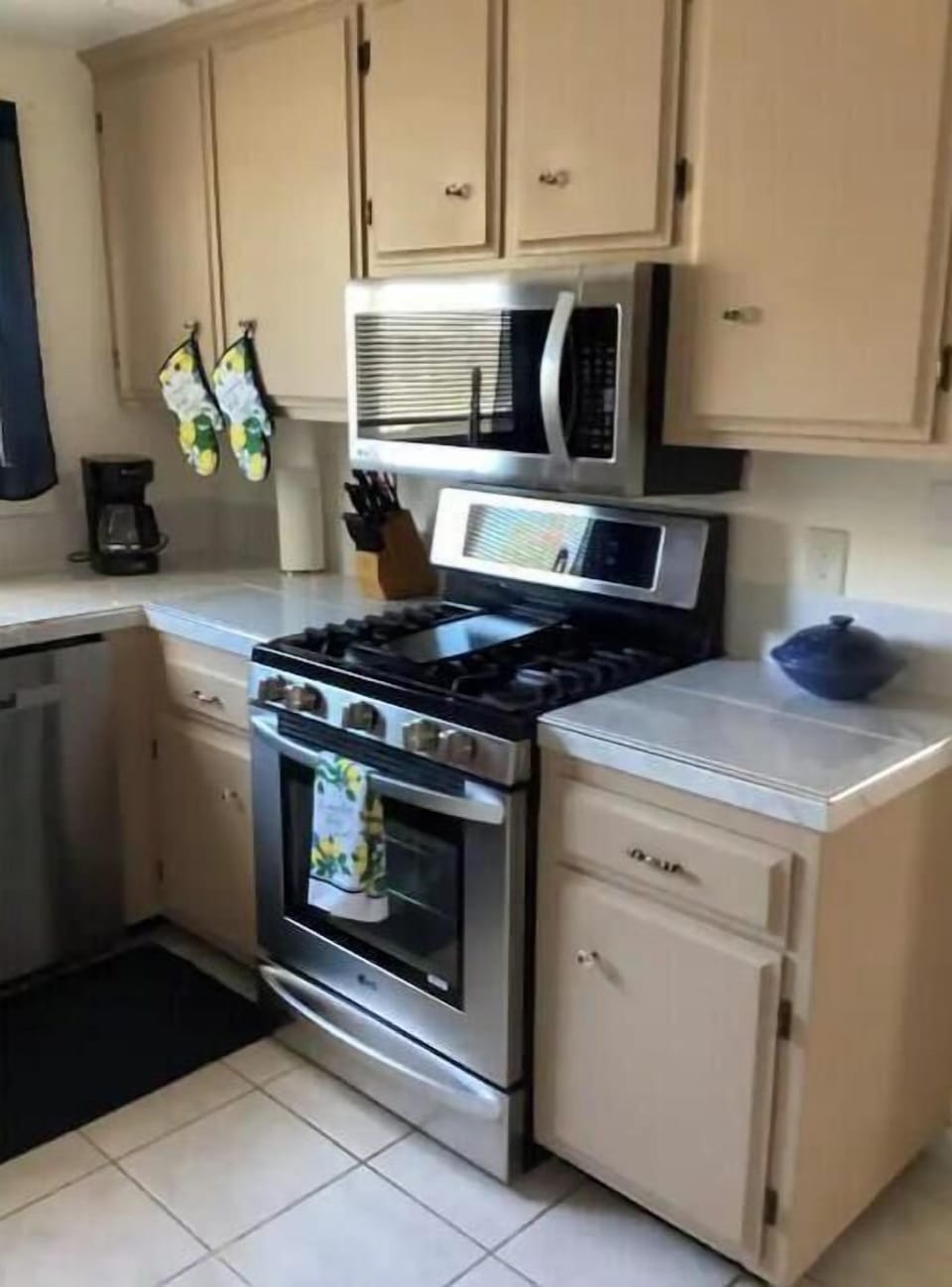 Five burner gas range with center grill if desired