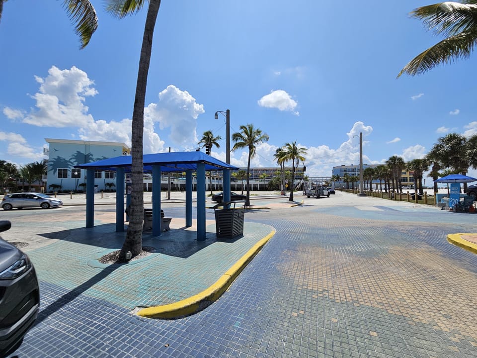 The Times Square trolley & bus stop with views of Estero Blvd and the new Margaritaville Resort.