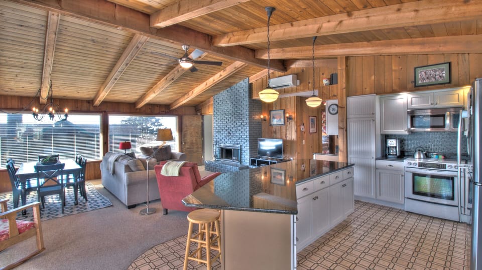 Sand Pads Kitchen Island and Living Area - Kitchen island with living and dining areas.