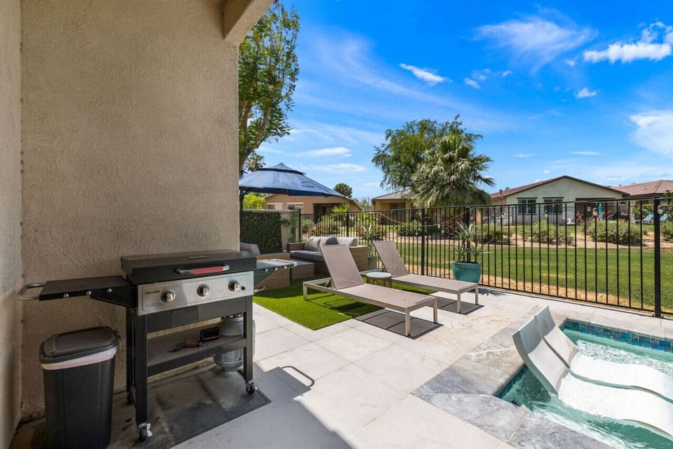 Covered patio w/ grill & prep space, great for easy outdoor cooking.