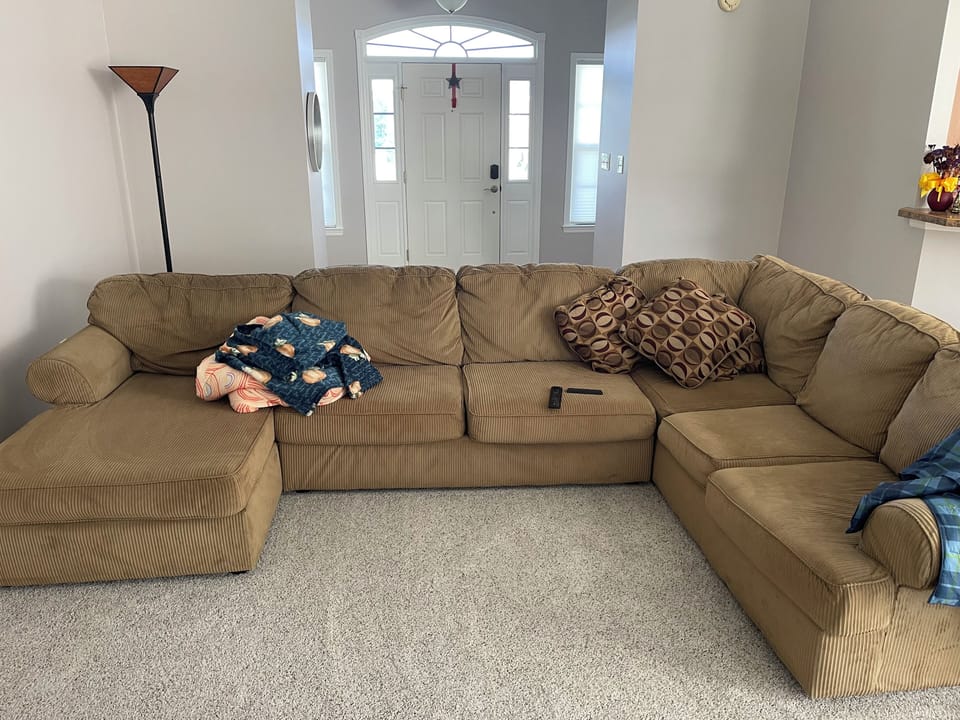 No hide-away bed in the couch.  Plenty of seating, looking out to the back yard.