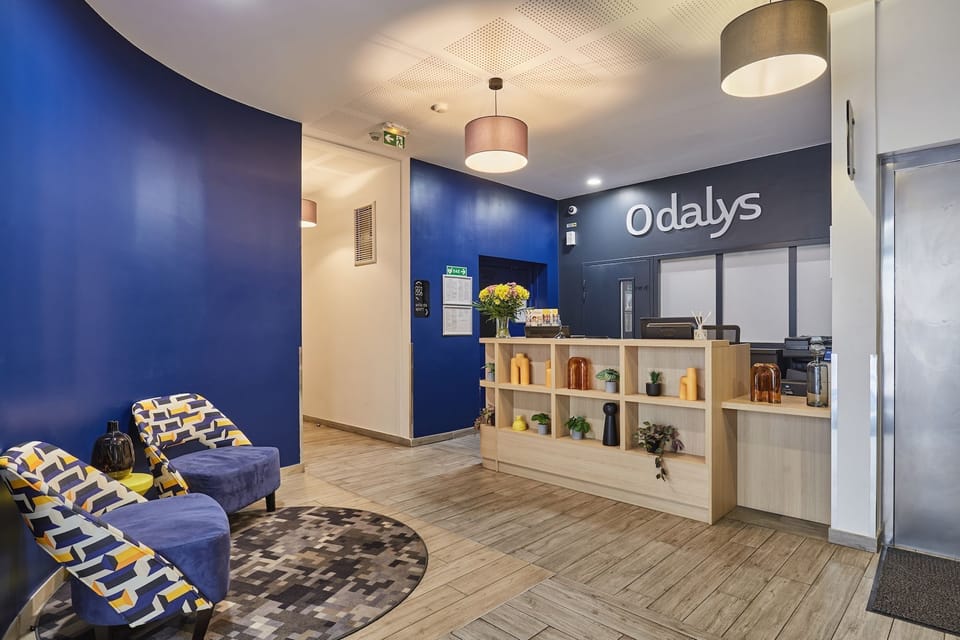 Cheerful reception desk with decorative touches and practical guest information.