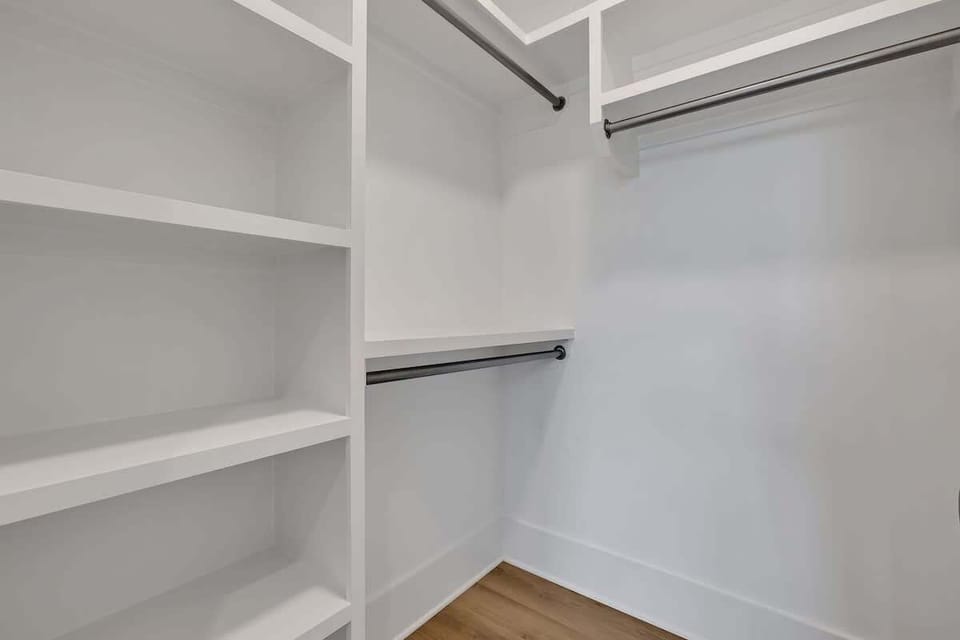 3rd Floor: Primary Bedroom featuring a luxurious King bed with a Smart TV, a walk-in closet and an ensuite Primary Bathroom.