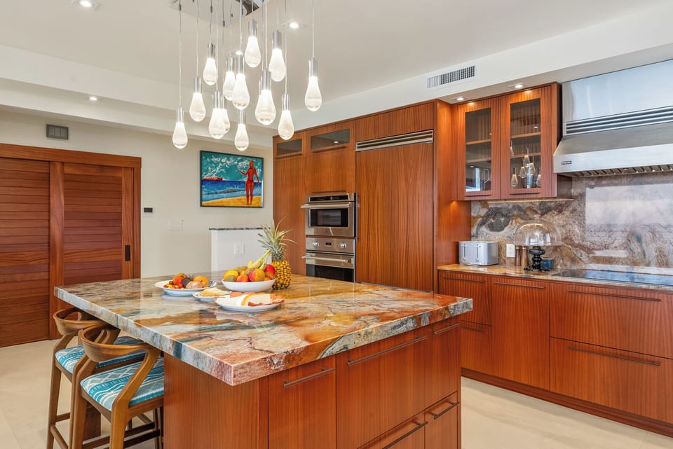 Dine at the kitchen island, at the inside dining table or outside on the Lanai