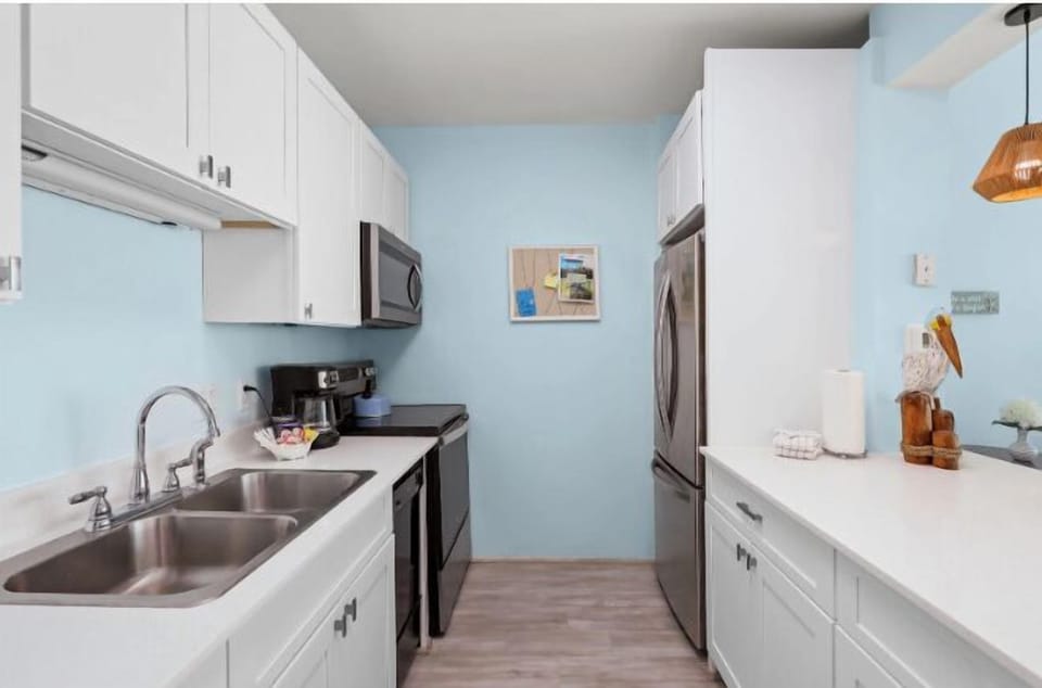 This spacious kitchen boasts full sixed appliances and this huge island counter.