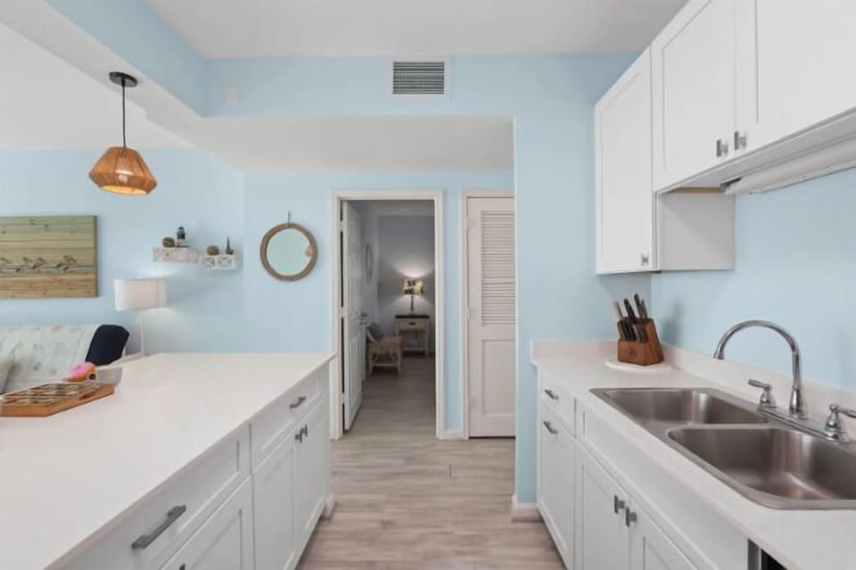 This spacious kitchen boasts full sixed appliances and this huge island counter.