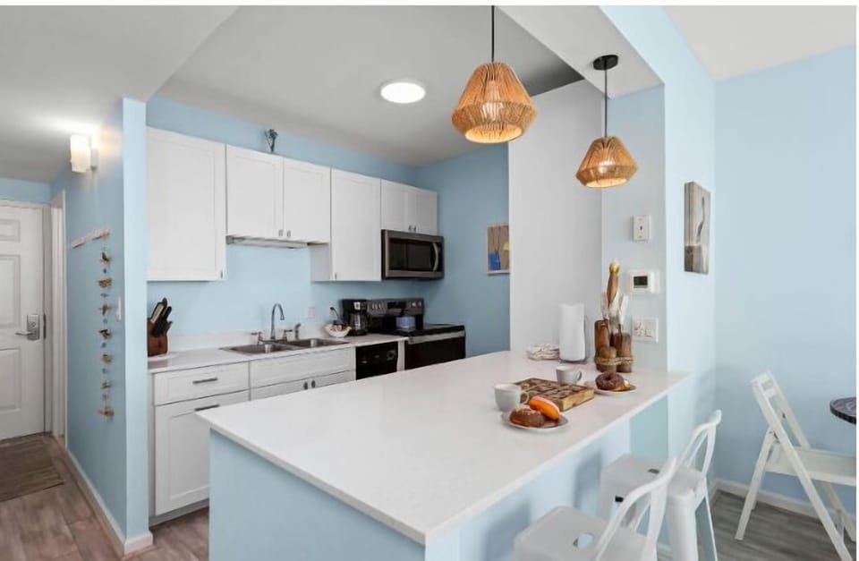 This spacious kitchen boasts full sixed appliances and this huge island counter.