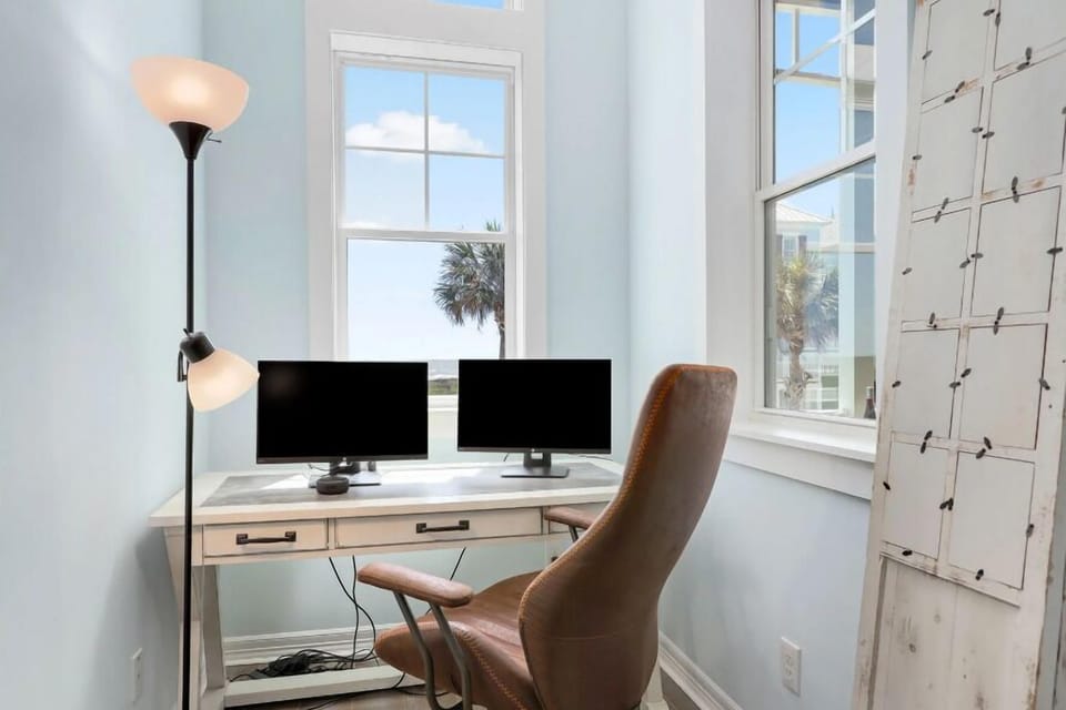 Enjoy the ocean view while you work or play games.  just off living area.  Monitors and power strip provided for use.