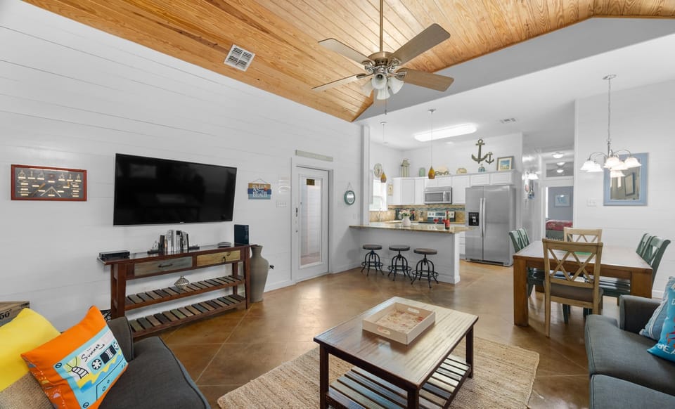 Open Living Area — Shiplap Walls, Wood Ceiling, Smart TV & Kitchen Bar