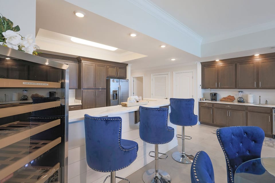 Perch on studded barstools at the marbled counter and sip a chilled drink from the nearby cooler