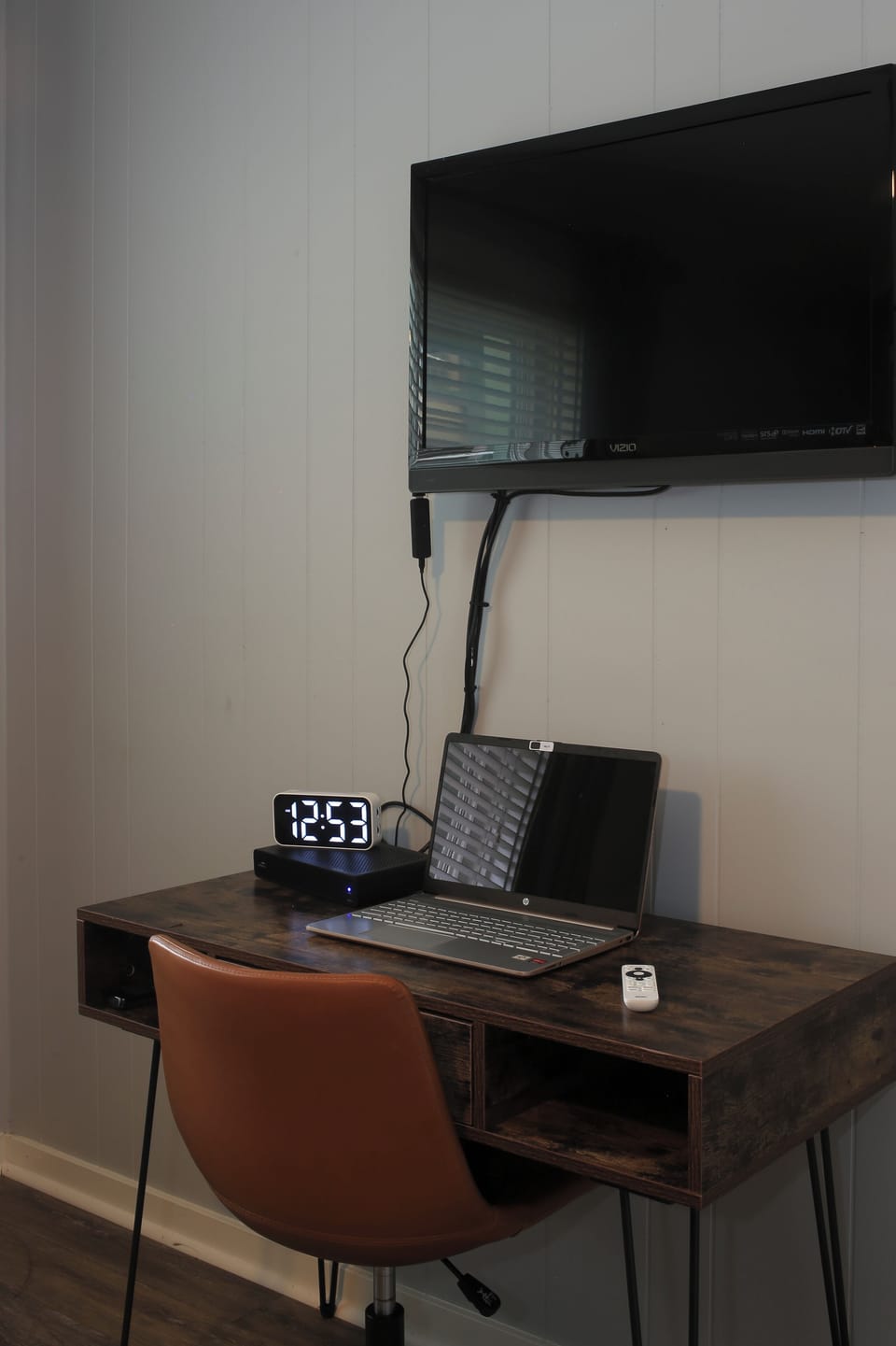 Workspace and smart TV in queen bedroom 