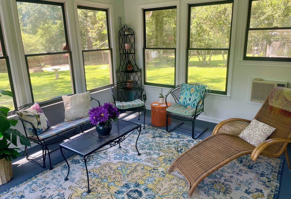 Relax in the sunroom w/ceiling fan, expandable dinette set, a/c unit w/remote.