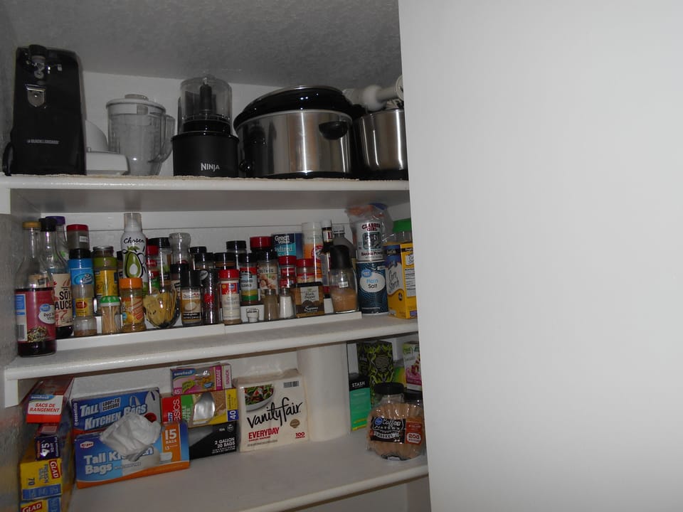 Stocked pantry staples, crock pots, coffee pots, immersion blender