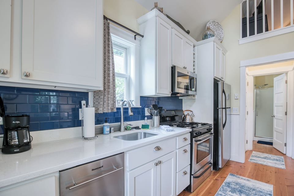 The master bedroom and bathroom are located past the kitchen. 