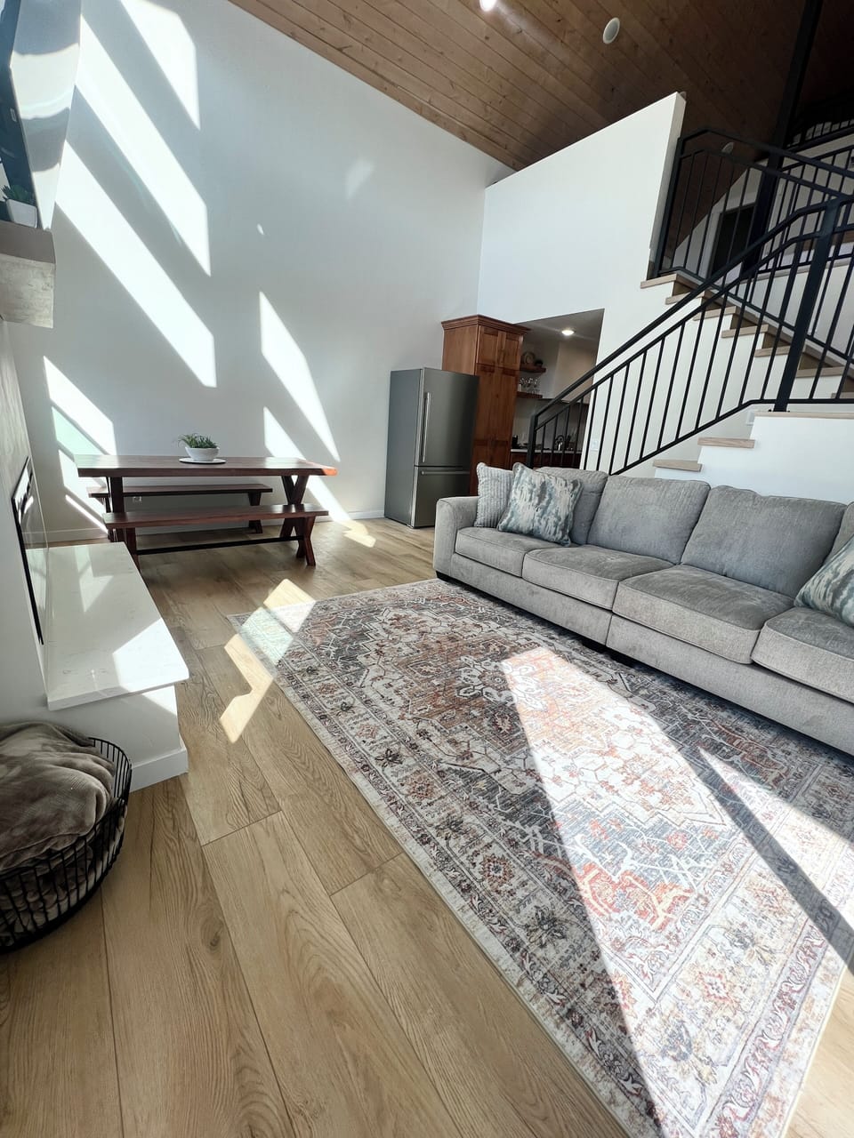 oversized couch, 65 inch TV above fireplace