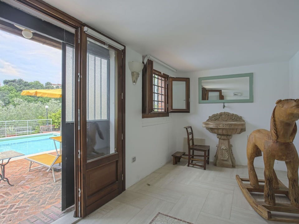 Furniture, Property, Ceiling Fan, Cabinetry, Table, Couch, Lighting, Picture Frame, Wood, Countertop