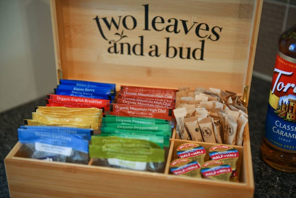 Choose from a variety of premium teas, including options from `Two Leaves and a Bud,` for a refreshing treat.