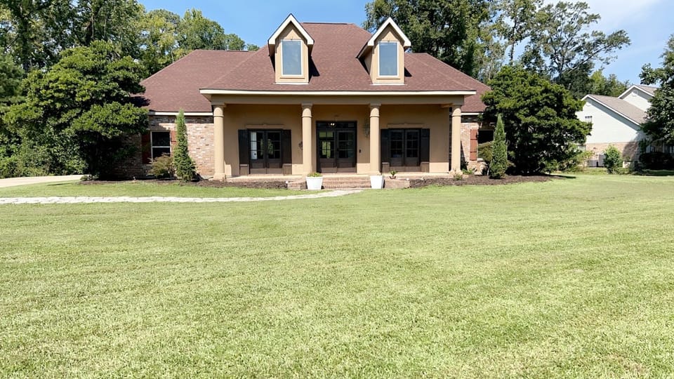 Front porch is long and perfect for spanning out a group to take pictures