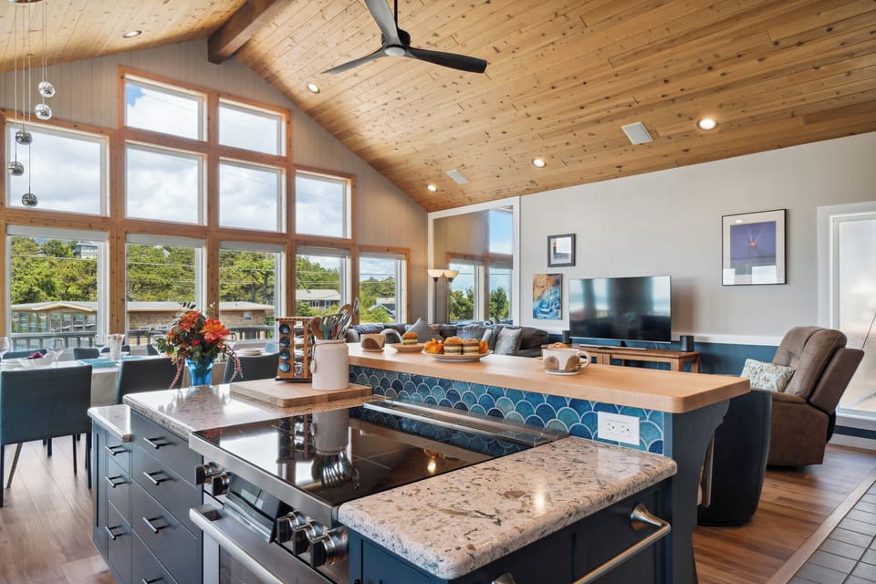 Open living space with newly remodeled kitchen, living room with Smart TV, streaming only, dining room. All with ocean views. Access to deck with outdoor seating and Gas BBQ.