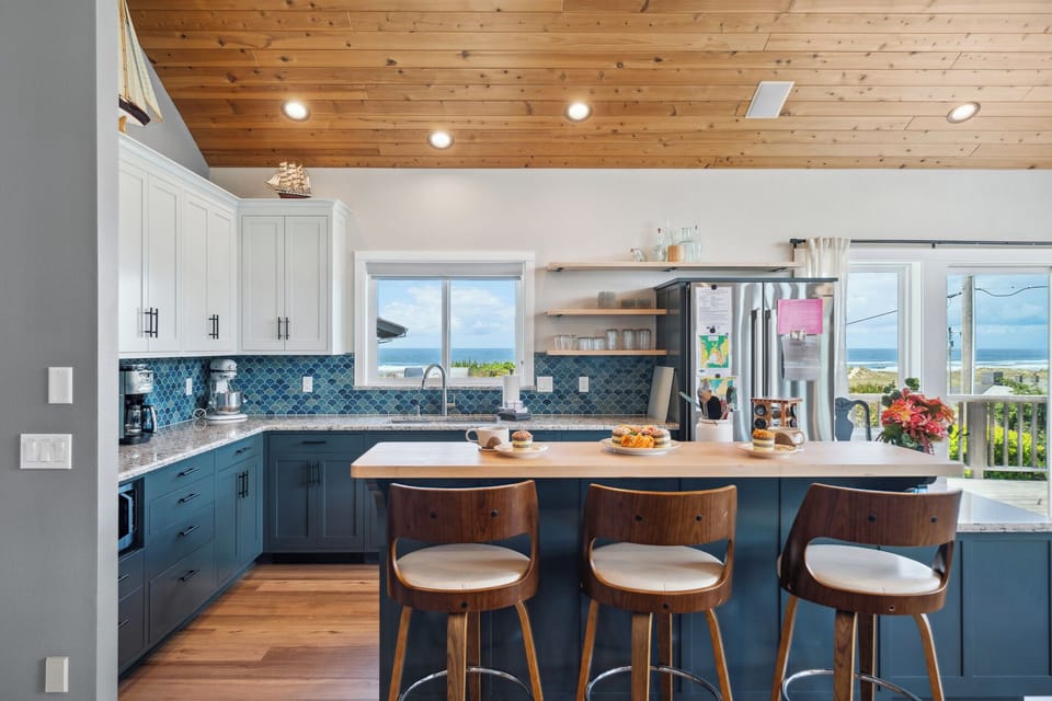 Open living space with newly remodeled kitchen, living room with Smart TV, streaming only, dining room. All with ocean views. Access to deck with outdoor seating and Gas BBQ.