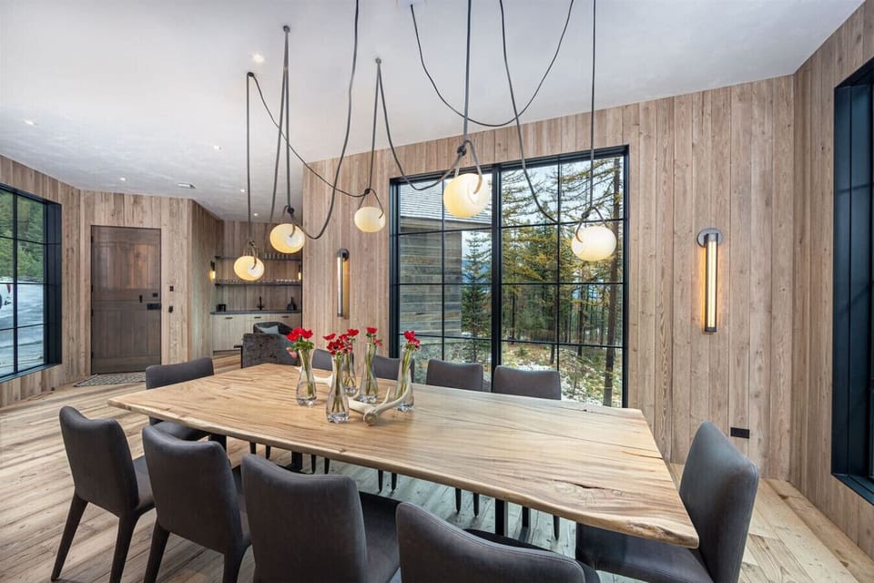 The custom light fixture is a beautiful focal point of the dining area.