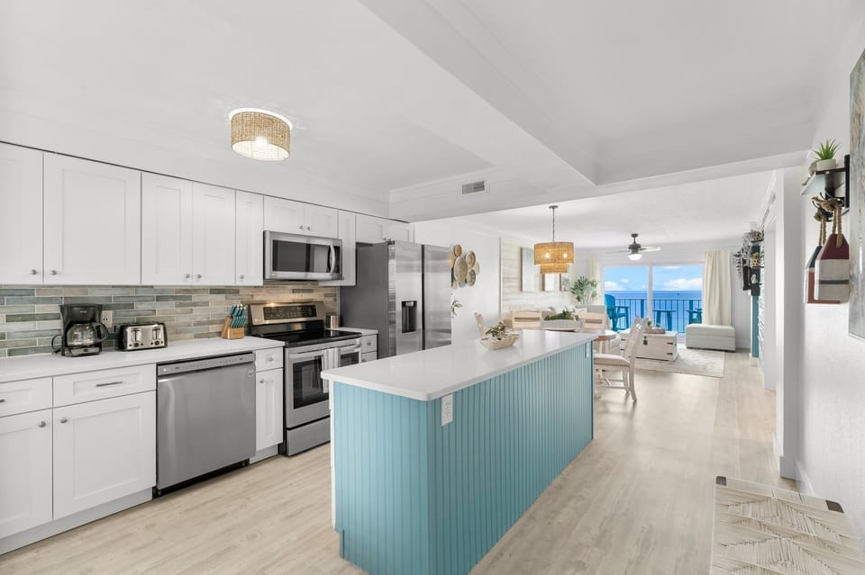 Whip up a delicious snack or a full meal in our bright, coastal kitchen while enjoying an open view to the ocean! Let the natural light dance on your countertops as you explore your culinary creativity amidst the soothing backdrop of crashing waves.