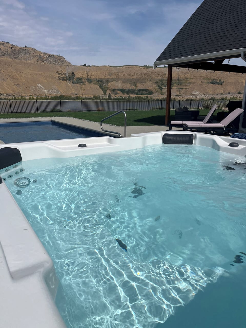 View from the hot tub over the pool and river