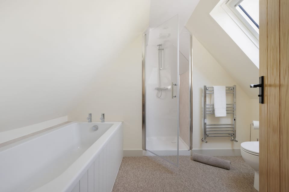 Family bathroom with a bath and separate walk-in shower