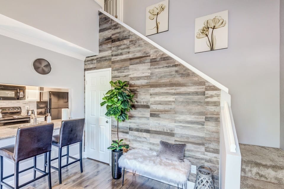 Cozy bar area allows you to chat with friends while cooking a meal.