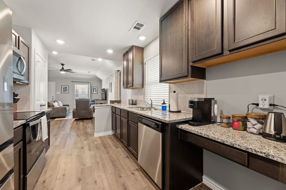 Kitchen area looks into open space living and dining area