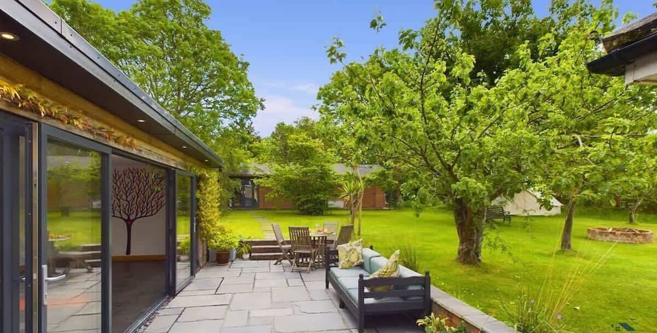 Relaxed garden space at The Timbers with seating or loungers — perfect for quiet afternoons or evening sundowners.
