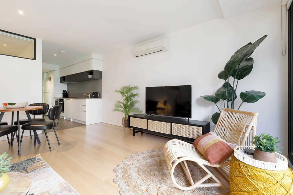 LIVING AREA: Nestle into the textured layers of the lounge and let the smart TV craft your perfect escape. From late-night films to curated playlists, it’s your gateway to effortless relaxation.