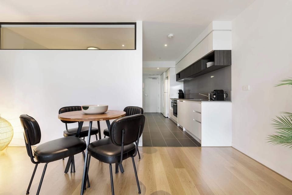 DINING: A cosy space with seating for four, perfect for casual meals and relaxed conversation.