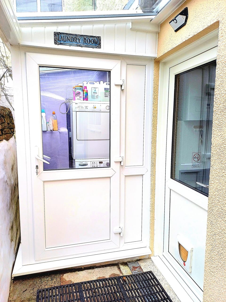 Laundry room and apartment entrance 