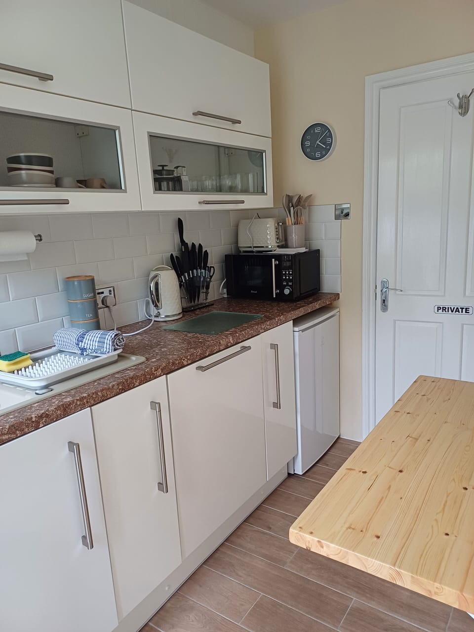 Galley kitchen with combi oven and dishwasher, plug in induction hob