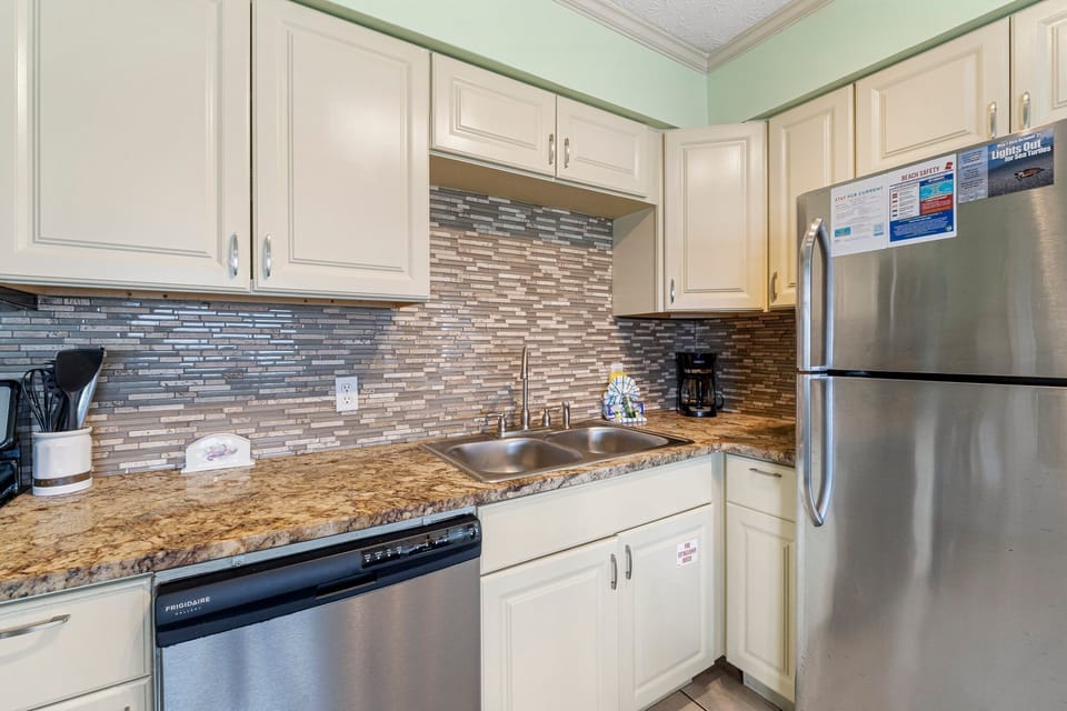 This adorable unit offers guests a full kitchen with stainless-steel appliances and everything you need to prepare meals for family and friends.